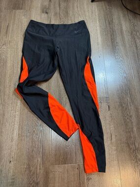 Nike Women's Black Swim Leggings with Bright Orange Panels